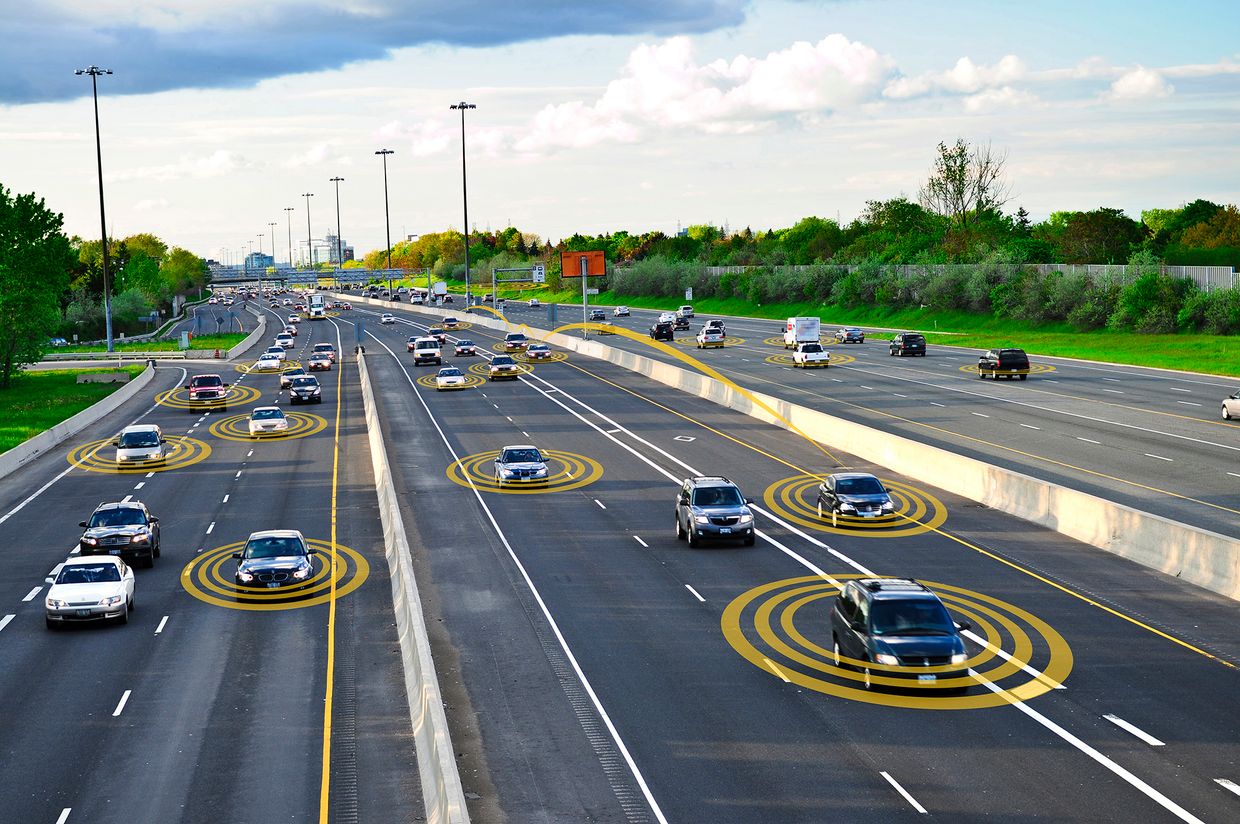 Vehicles traveling on a highway with circles radiating from them to indicate connectivity